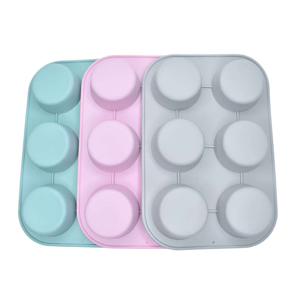 Grey, pink, and blue Big Muffins Chocolate Molds stacked on a white background for clear view