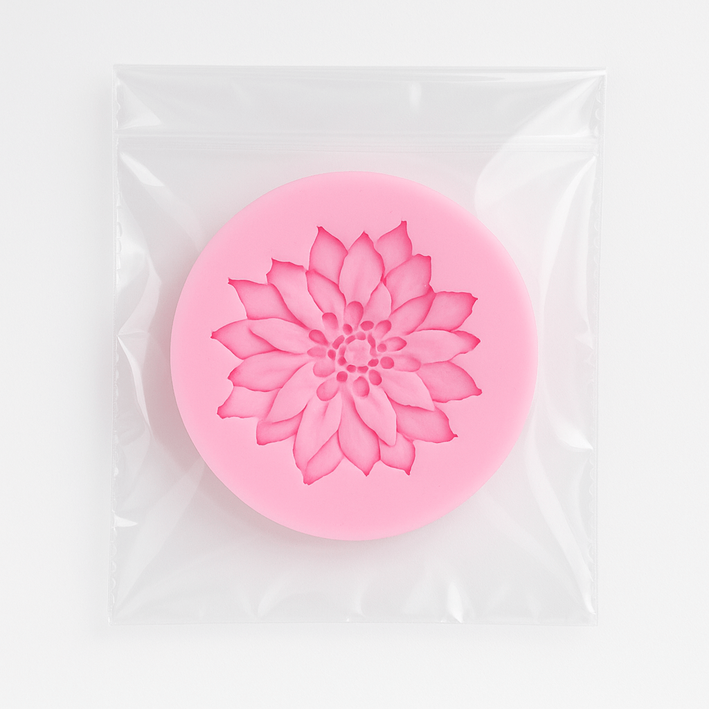 Flower silicone fondant mold in its packing on a clear white background