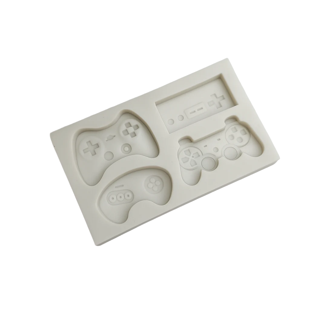 Silicone fondant mold shaped like gaming controllers on a white clear background
