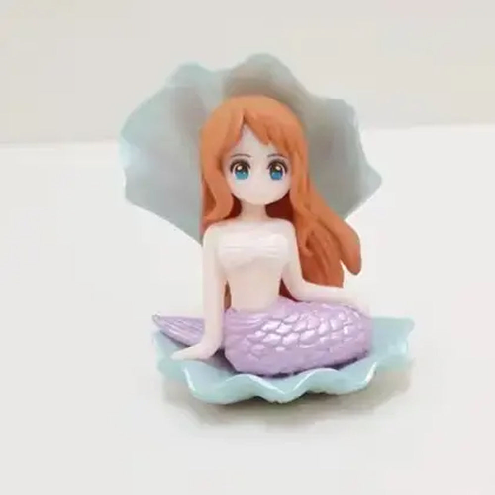 Miniature mermaid cake topper with long orange hair, light purple glitter tail, and seafoam shell base – ideal for under the sea themed birthday cakes, mermaid baby shower decorations, and ocean party fondant toppers.