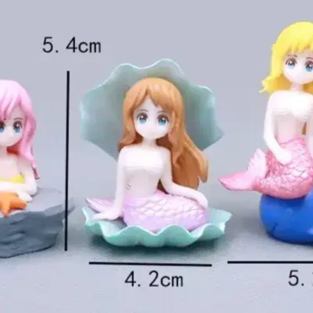 Miniature brown-haired mermaid figurine with lavender tail sitting in a mint green seashell – 5.4 cm under the sea cake topper perfect for mermaid-themed birthday parties, baby shower decorations, and fondant cake designs.