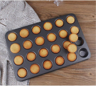 24 in 1 Muffin and Cupcake Baking Tray in use, filled with batter for baking muffins and cupcakes.