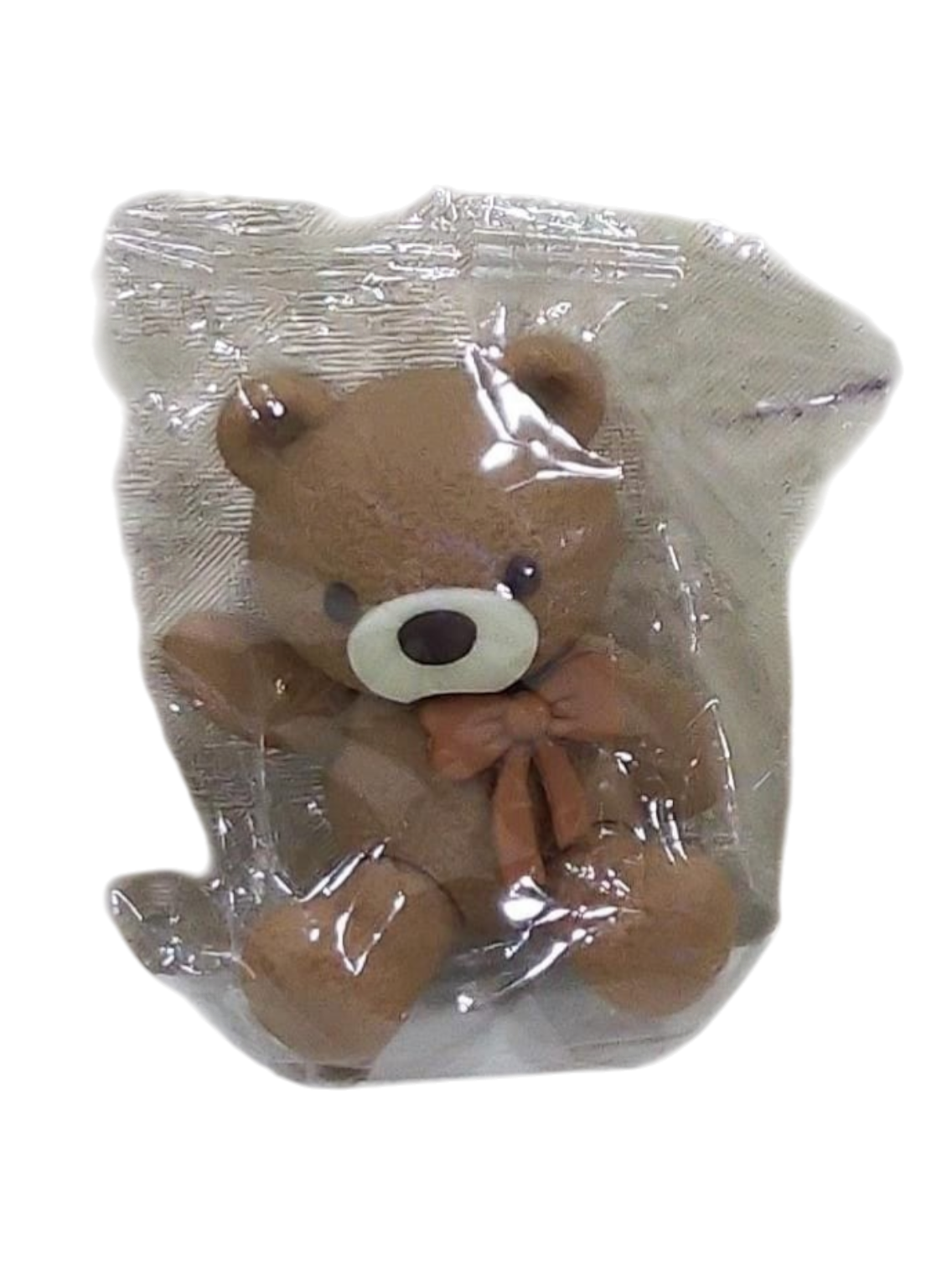 Cute Teddy Cake Toy Topper – Bow Bear Decorationin transparent packaging on a transparent background