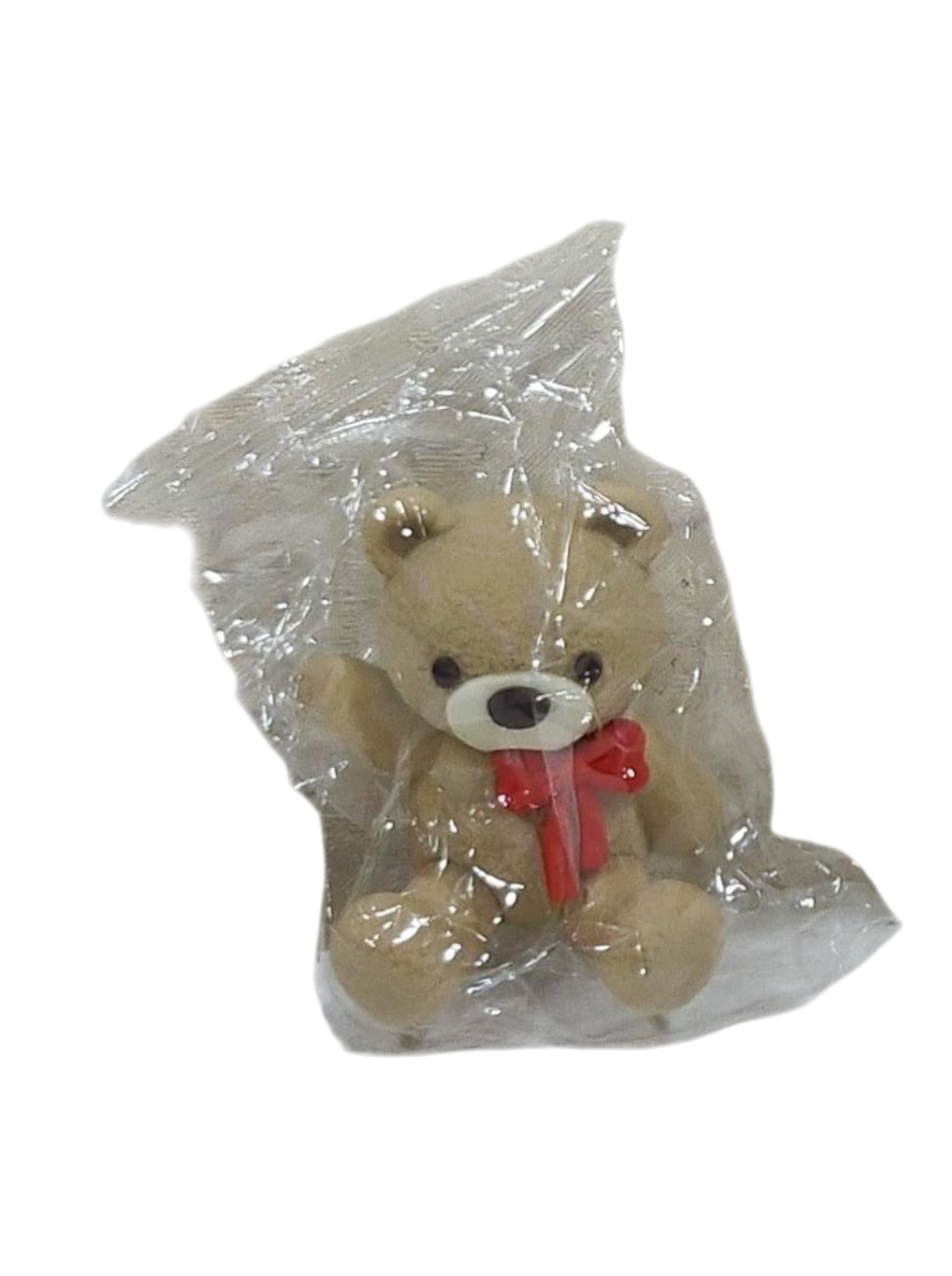 Cute Teddy Cake Toy Topper – Bow Bear Decoration in transparent packaging on a transparent background
