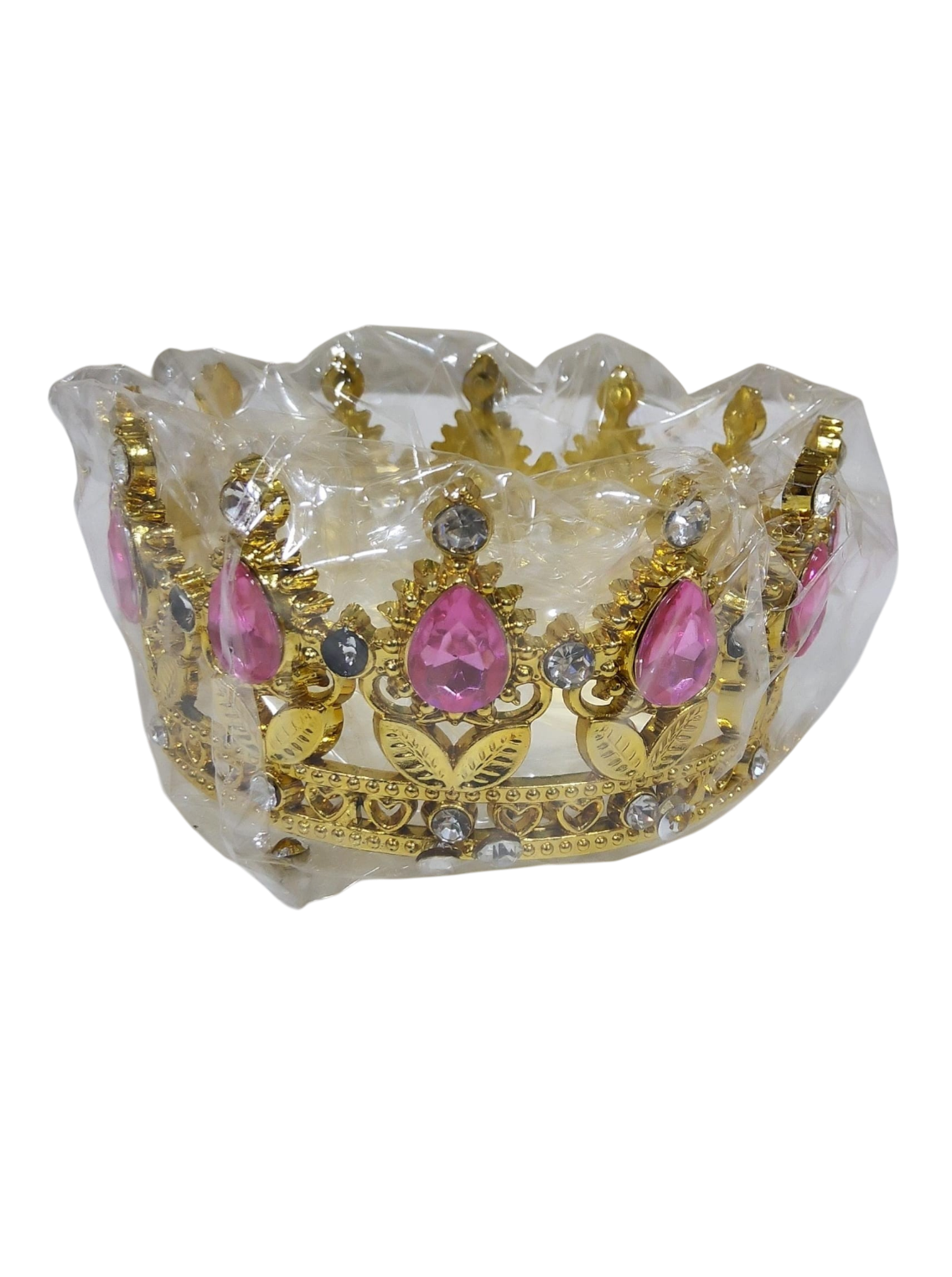 Decorative gold Crown in Transparent  Packing and pink stones on a white background