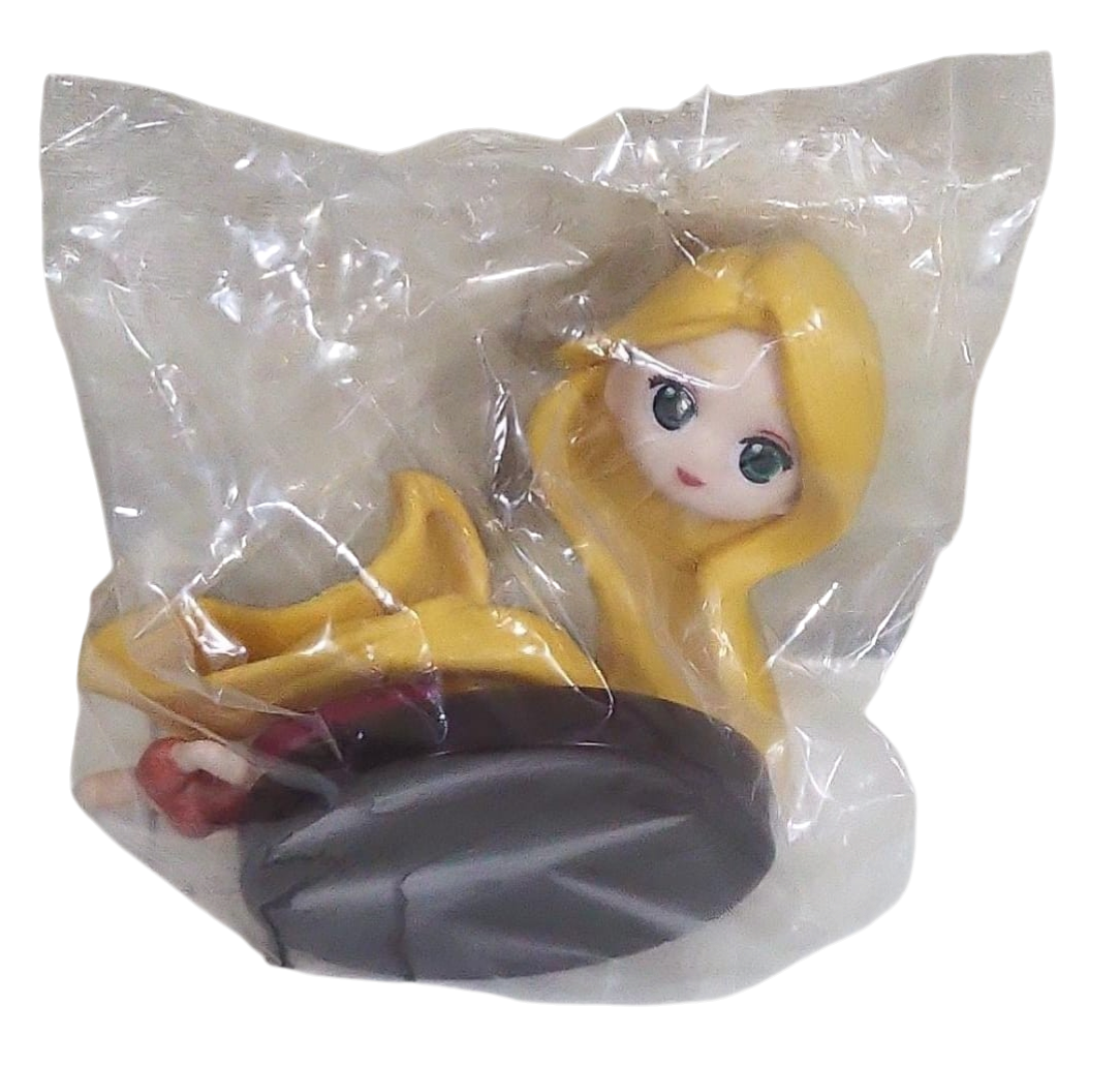 Toy figure of a princess with long blonde hair in a transparent plastic bag and on a transparent background.