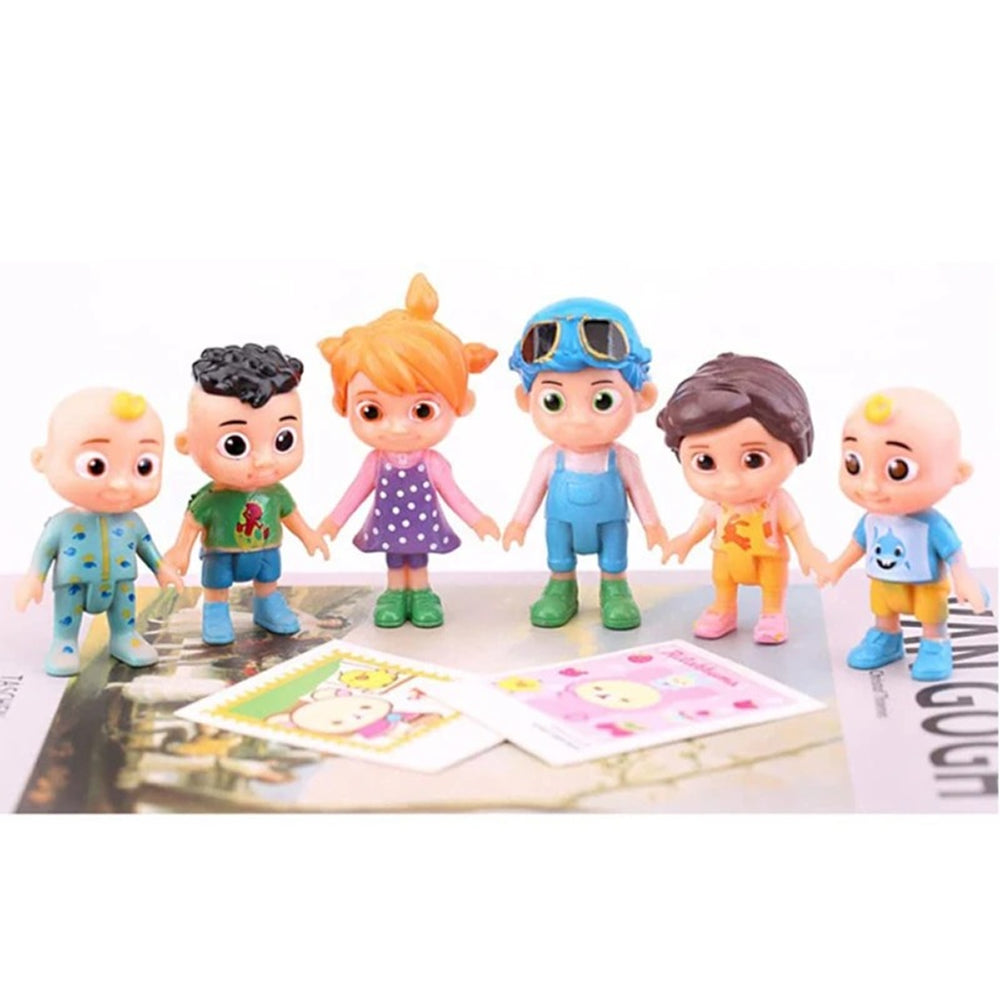 Close-up of 6 Cocomelon Toy Cake Toppers arranged on white background