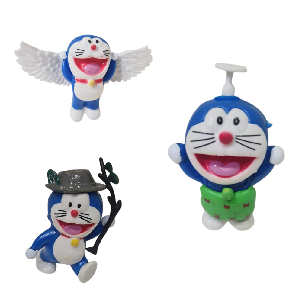 Close-up of 3 Doraemon Toy Cake Toppers arranged on white background
