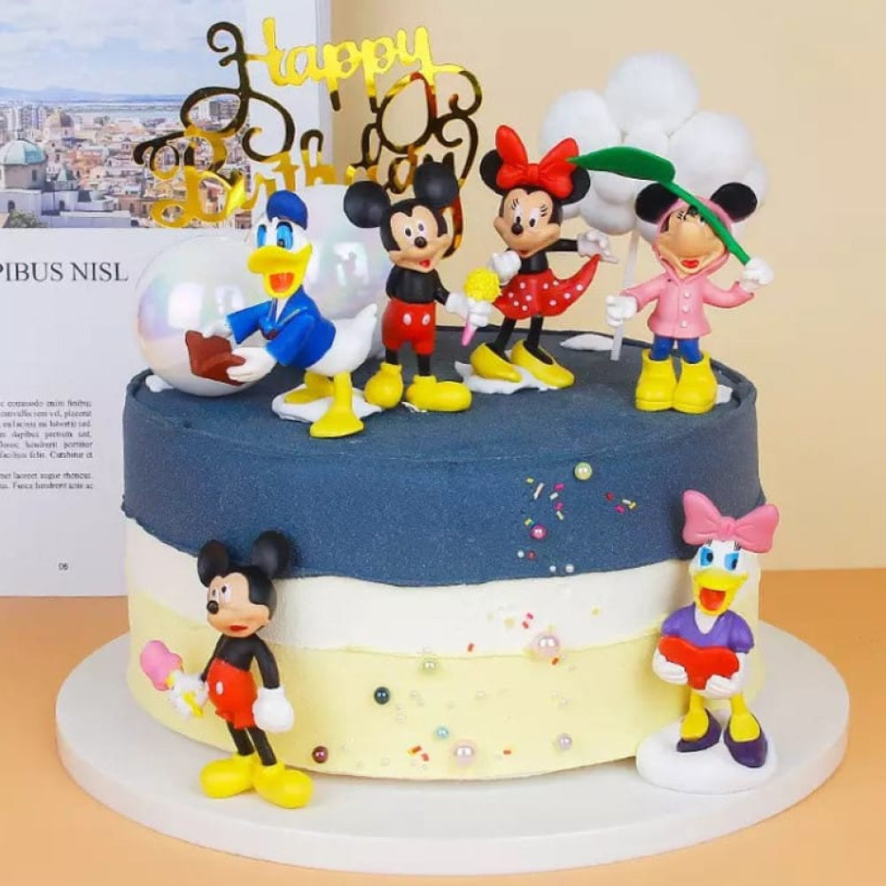 Zoomed-in view of Mickey and Friends Cake Toppers placed on real cake