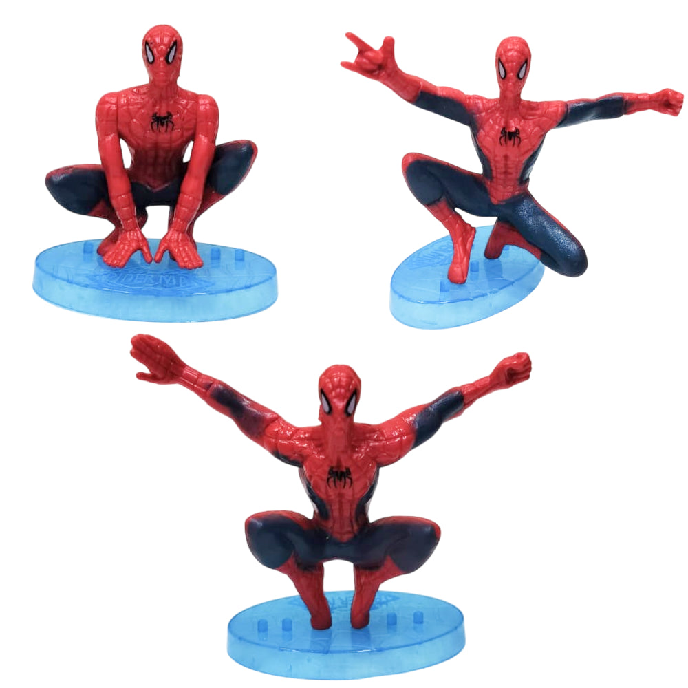 Close-up of 3 Spiderman PVC Cake Toy Toppers arranged on white background