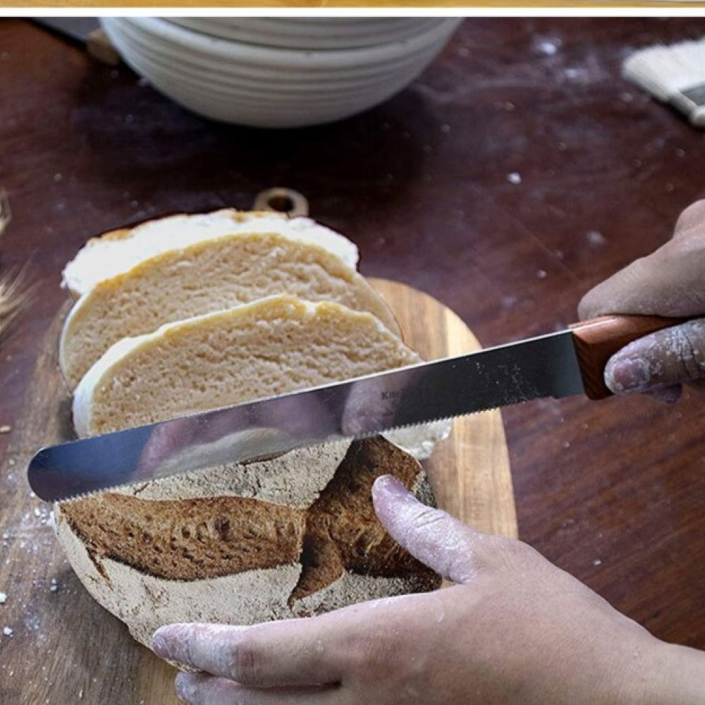 8 Inch Wooden Handle Knife in use, demonstrating its precision for cutting and shaping cake layers or fondant.