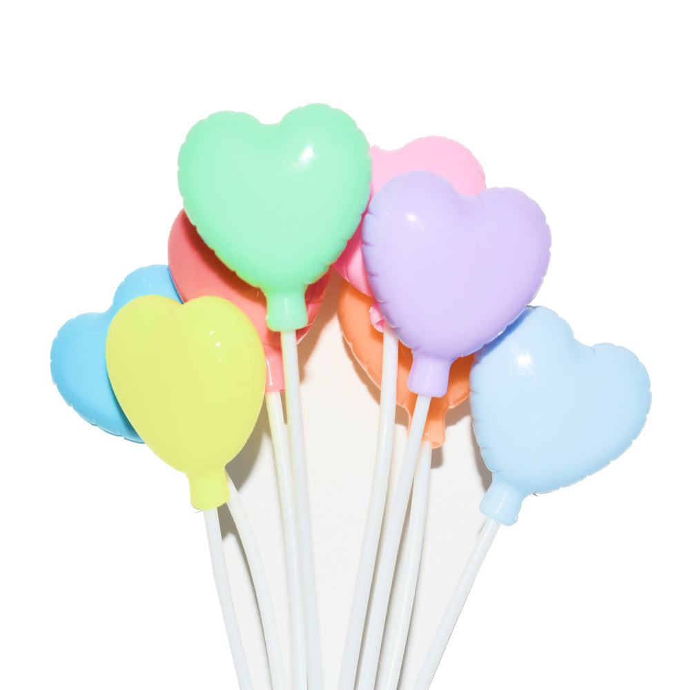 Close-up view of 8 Piece Heart Shaped Plastic Balloon Cake Topper with clear details on a white background.
