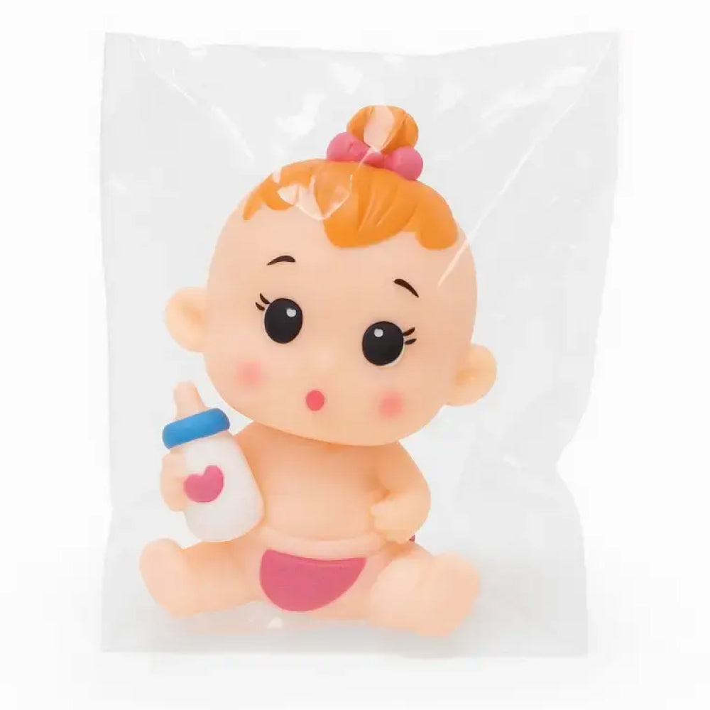 Baby girl cake toy topper sealed in a transparent plastic pouch, featuring an orange-haired baby with big eyes, pink diaper, and heart milk bottle – ideal for baby shower desserts, girl’s first birthday cakes, cupcake toppers, or cute baby-themed cake decorations