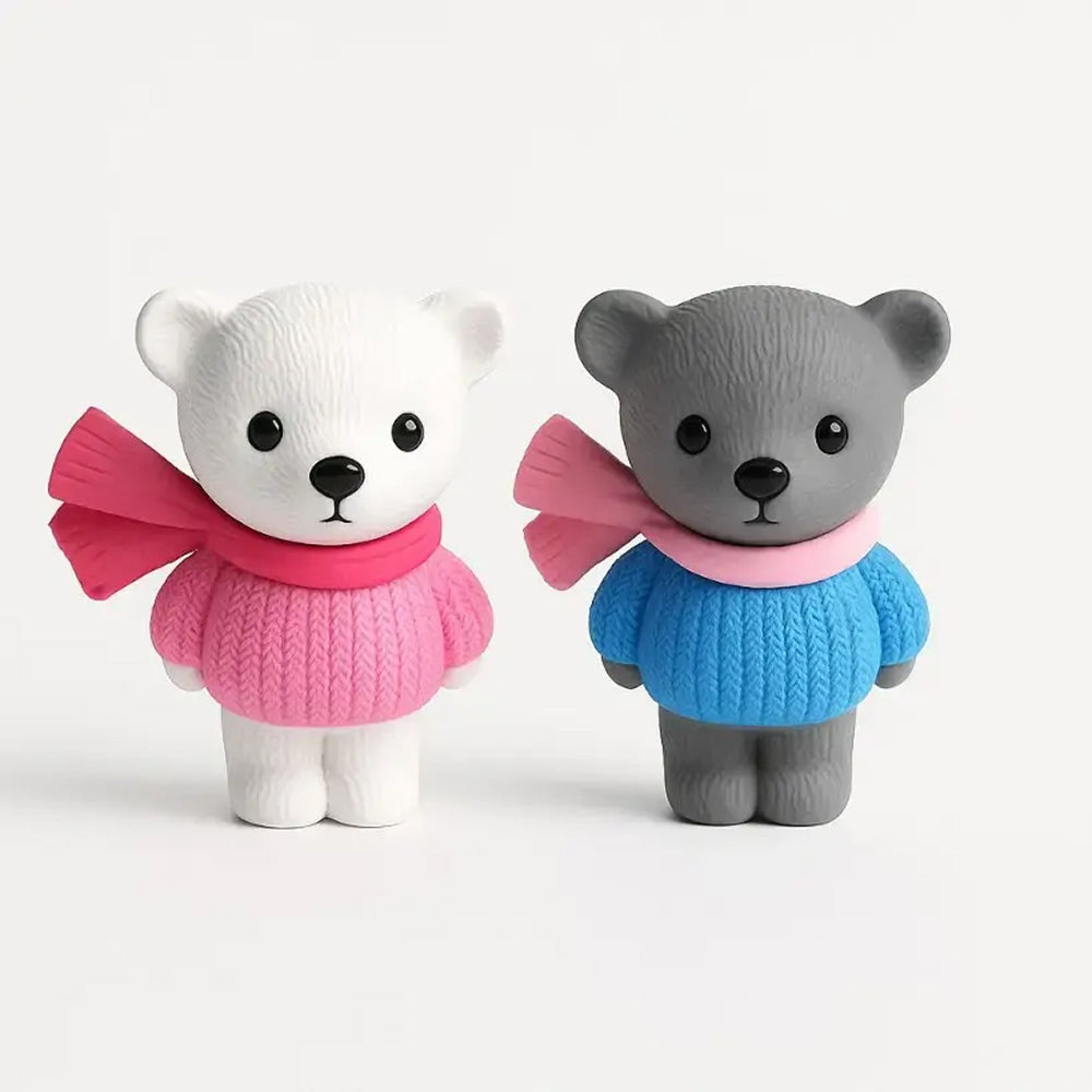 Miniature bear figurines in pink and blue winter sweaters with scarves, featuring a white and grey bear – adorable cake decoration or collectible piece