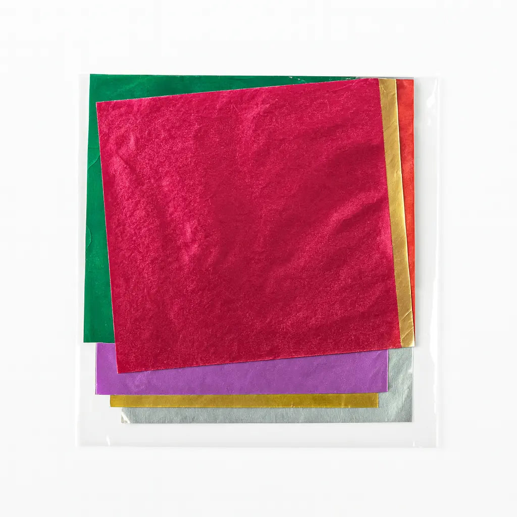 Colorful chocolate wrappers on a white background