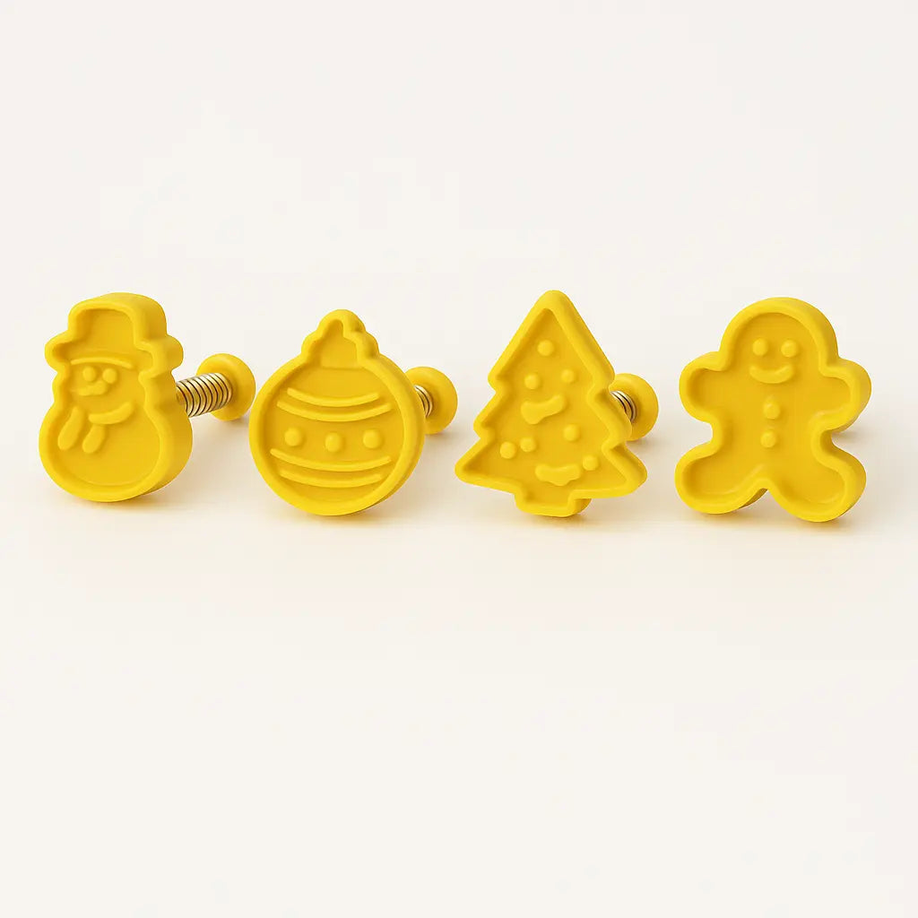 Four yellow cookie & Fondant cutters shaped like a tree, star, circle, and gingerbread man on a white background.