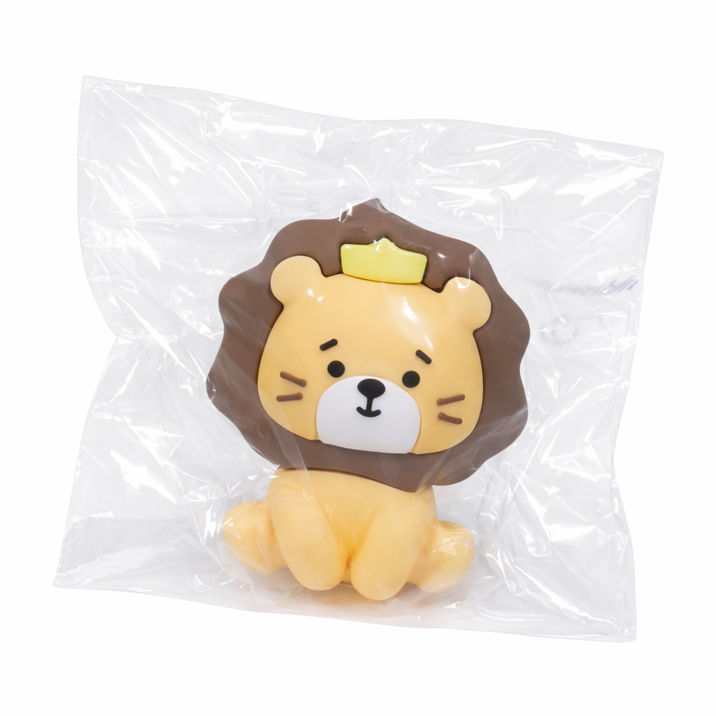 PVC toy lion with a crown in clear transparent packaging on a transparent background