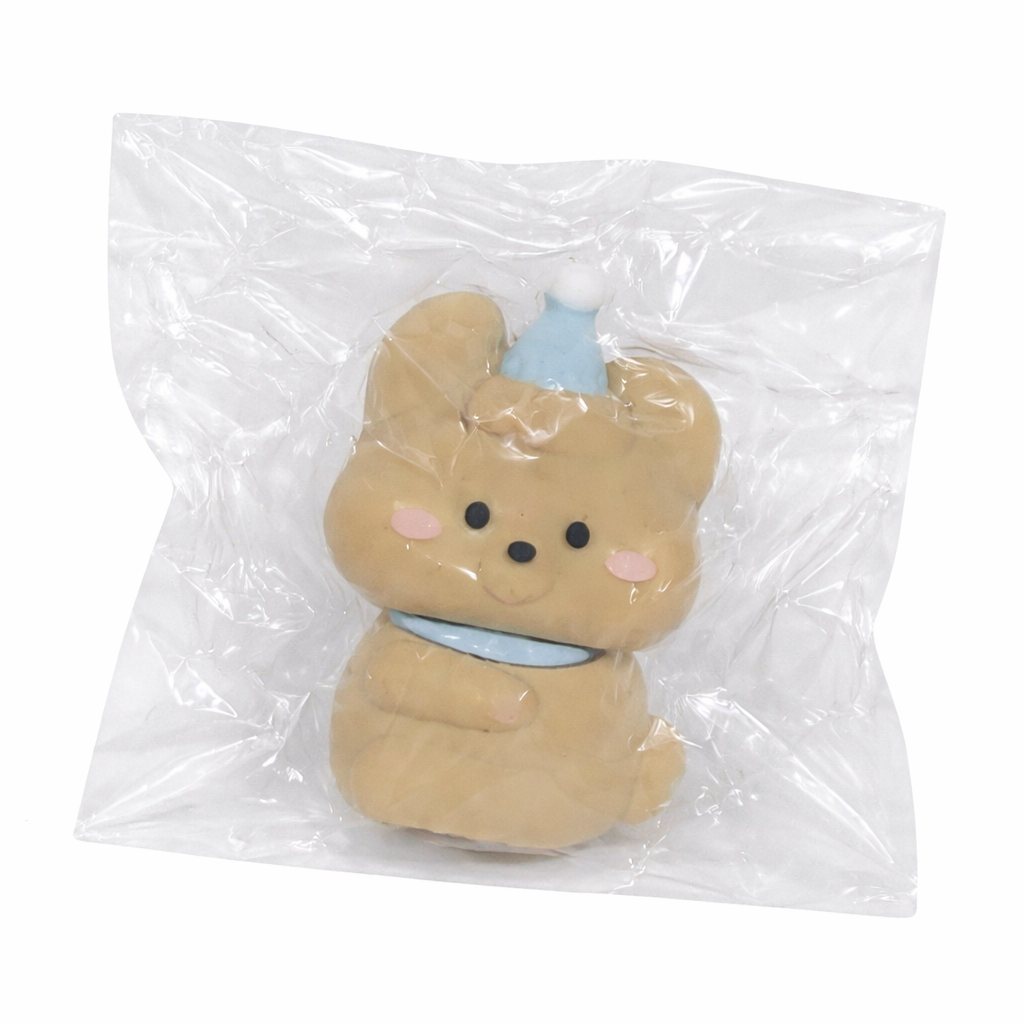 Plush brown toy in a clear transparent bag on a white background