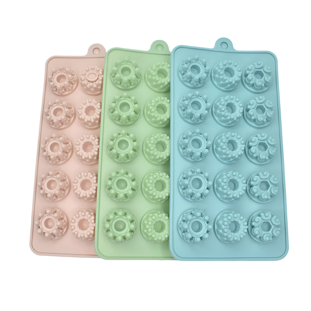 Christmas Themed Chocolate Molds stacked in blue, green, and red on a white background for clear view