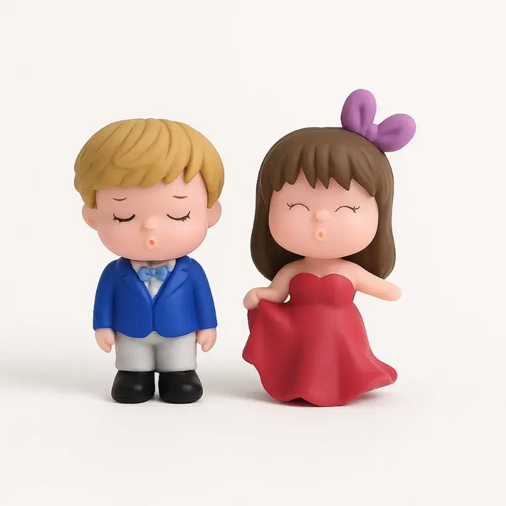 Couple figurines kissing – boy in blue tuxedo and girl in red dress with purple bow – cute miniature cake topper decoration for romantic occasions