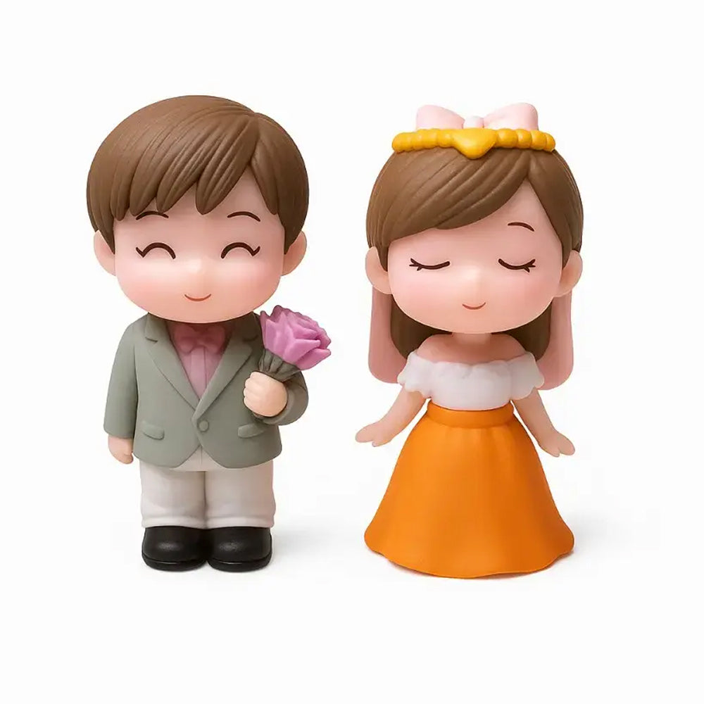 Miniature couple figurines with boy in grey blazer holding pink rose and girl in white top with orange skirt – perfect for wedding cake toppers, anniversary décor, Valentine's gifts, and fondant romantic cake themes.