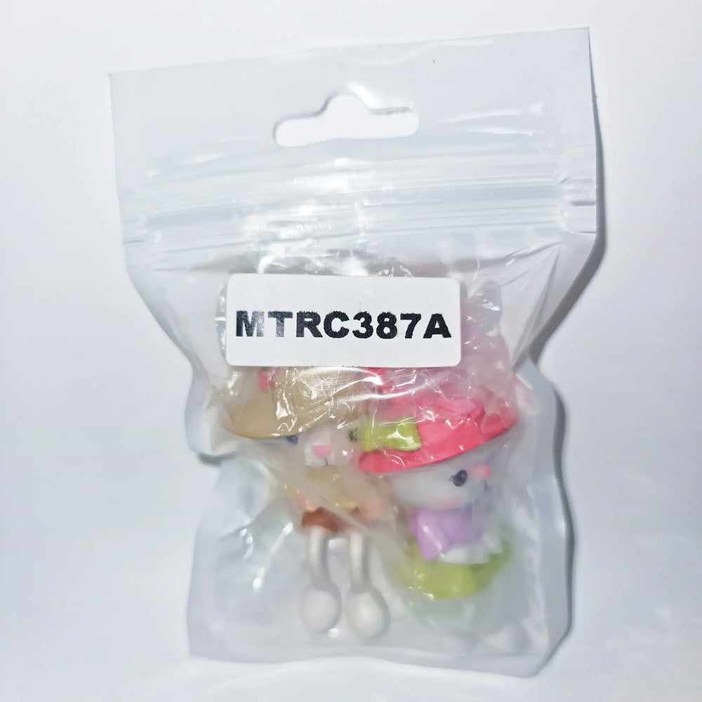 Bunny couple miniature set labeled MTRC387A – packaged cute rabbit figurines with colorful hats, ideal for Easter cake toppers, baby shower décor, and fondant bunny themes.