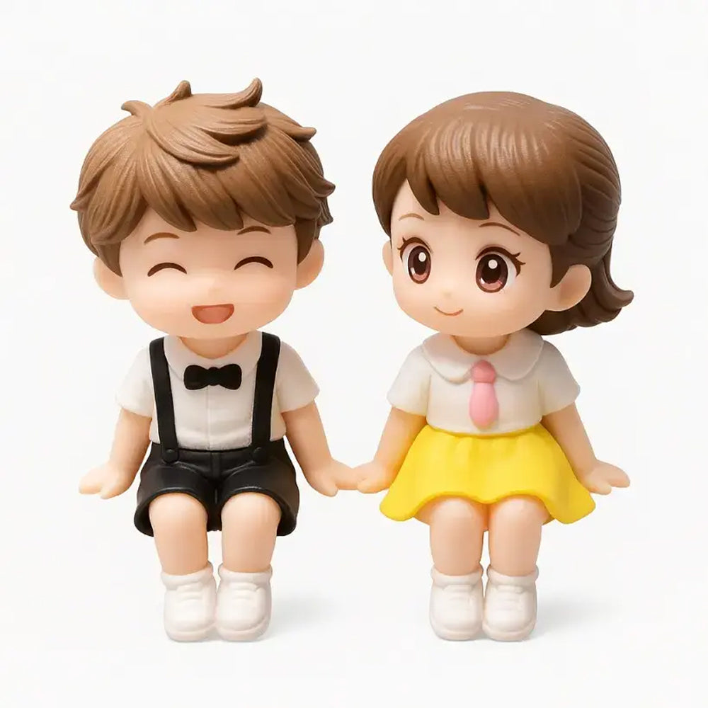 Romantic couple miniatures sitting side by side, holding hands – boy in black suspenders and girl in yellow skirt – adorable toy toppers – MTRC329B