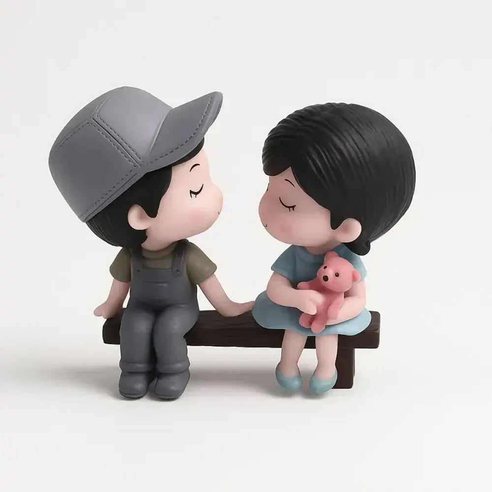 Unpackaged couple miniature sitting on a bench with the girl holding a teddy bear – sweet cake topper for Valentine's Day, anniversaries, or romantic gifts