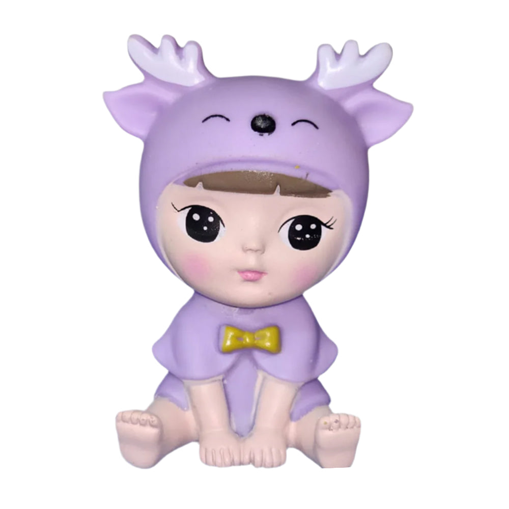 Close-up of Cute Sitting Baby Cake Toy Topper on white background