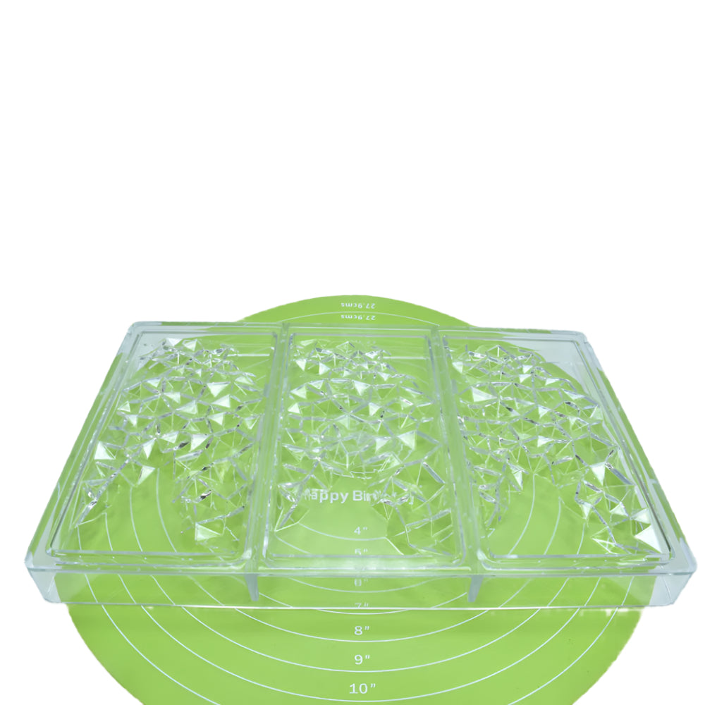 Diamond Cut Polycarbonate Chocolate Mold placed on a green baking mat against a white background for a detailed view.