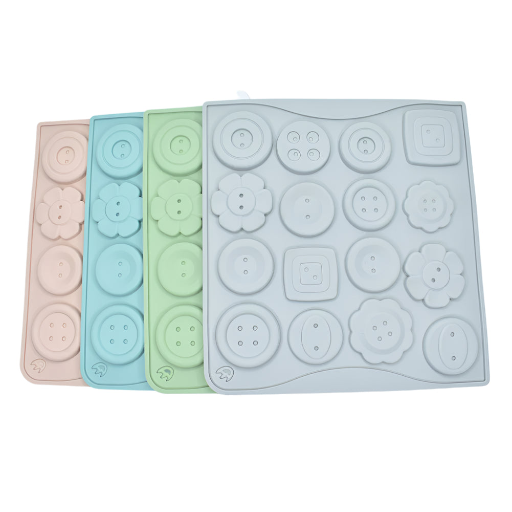 Different Buttons Chocolate Molds in gray, green, blue, and pink stacked on a white background for clear view