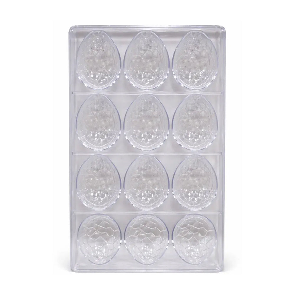 Clear polycarbonate container with multiple compartments holding small round objects on a white background