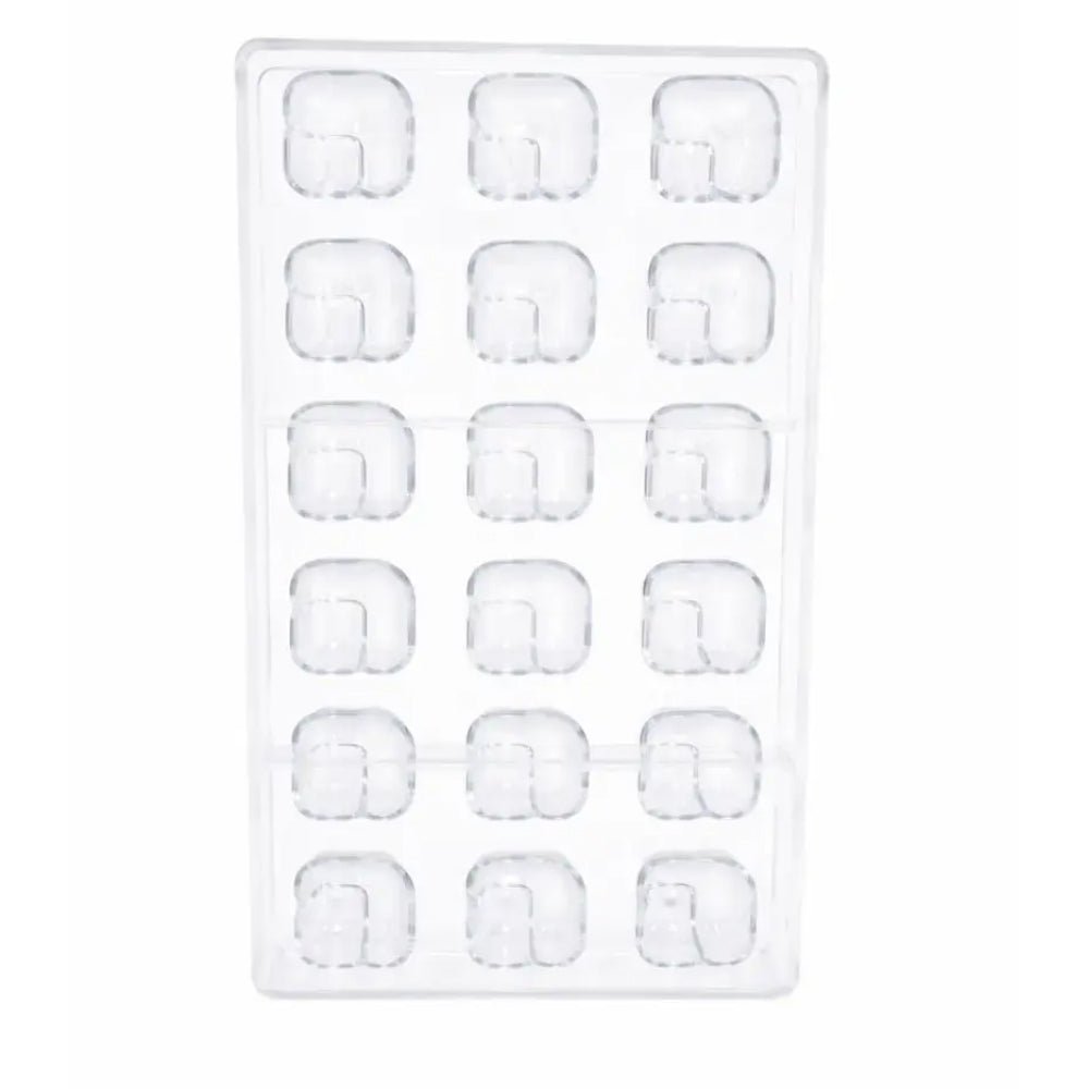 polycarbonate mold with square shapes on a white background