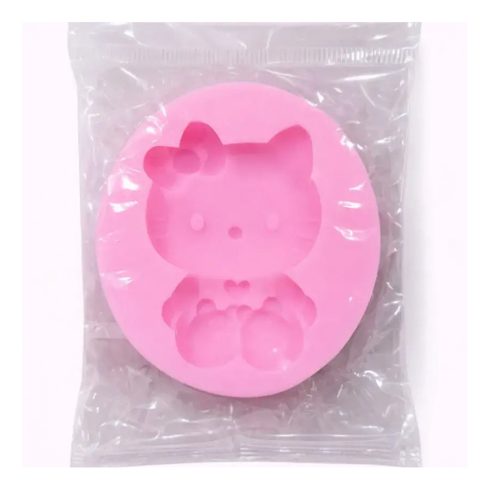 Pink silicone mold shaped like a cat in a clear plastic bag
