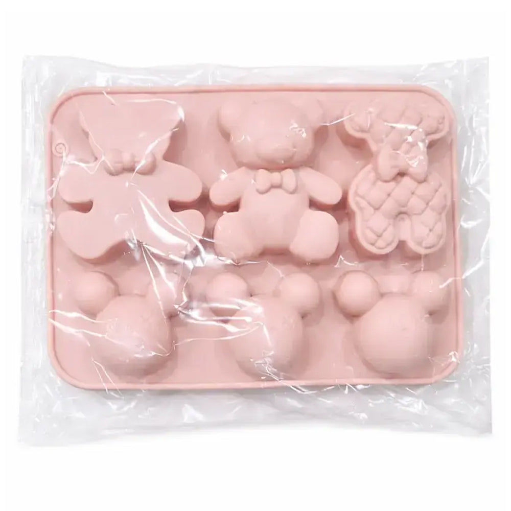 Pink silicone mold with animal shapes in clear packaging on a white background