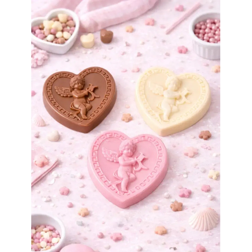 Heart-shaped chocolate candies with angel designs on a pink background