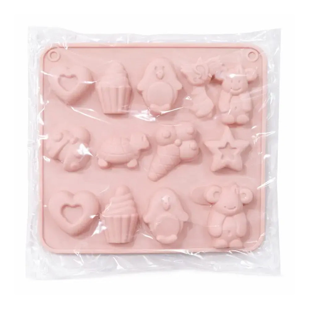 Pink silicone mold with various shapes in clear packaging on a white background