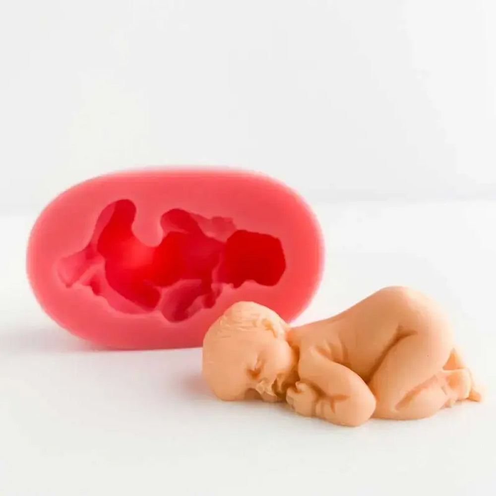Silicone mold shaped like a pregnant woman with a baby inside on a white background