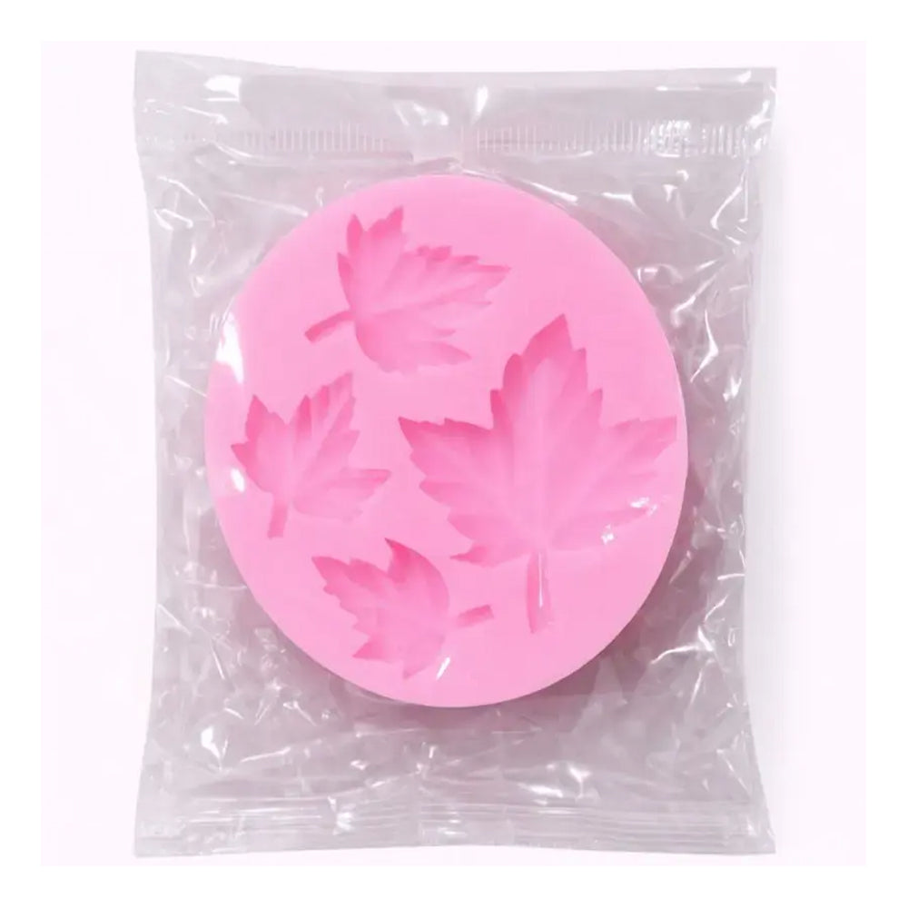 Pink silicone mold with leaf pattern in clear packaging on a white background