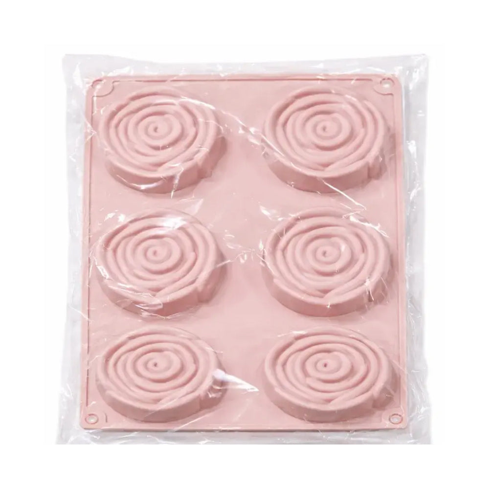 Pink silicone mold with spiral patterns in clear packaging on a white background