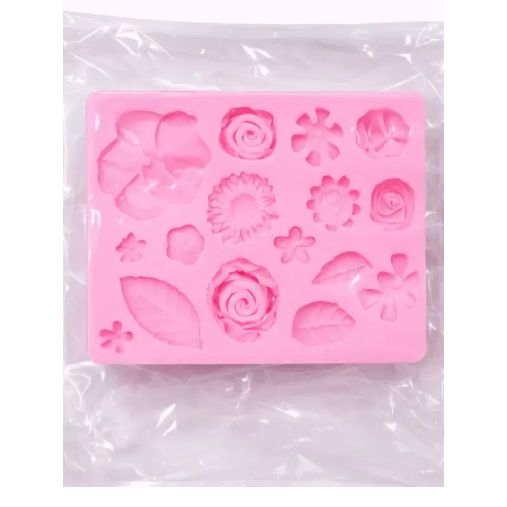 Pink silicone mold with floral designs on a white background