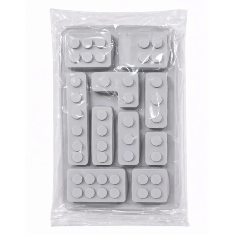 Silicone mold shaped like building blocks in a clear plastic package on a white background