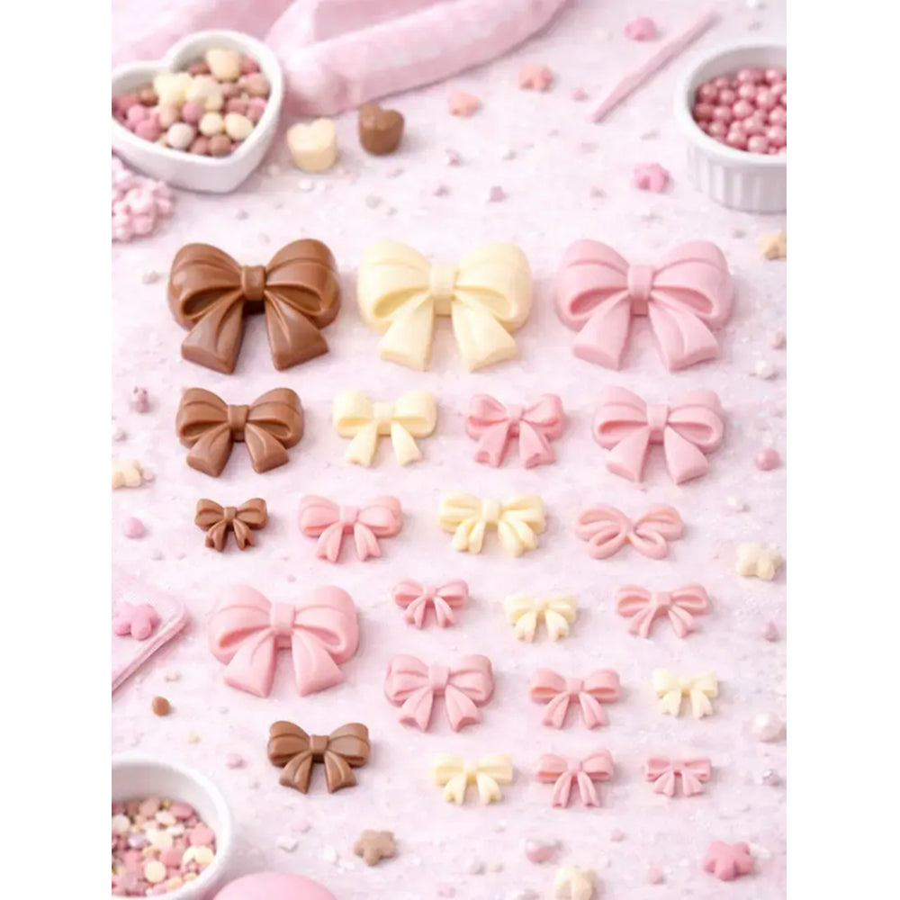 Colorful bow-shaped candies on a pink background