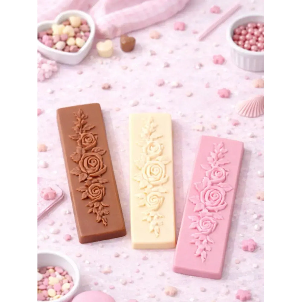 Three rectangular silicone molds with floral designs on a pink background.