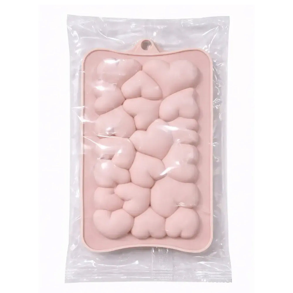 Pink silicone mold with heart shapes in clear packaging on a white background