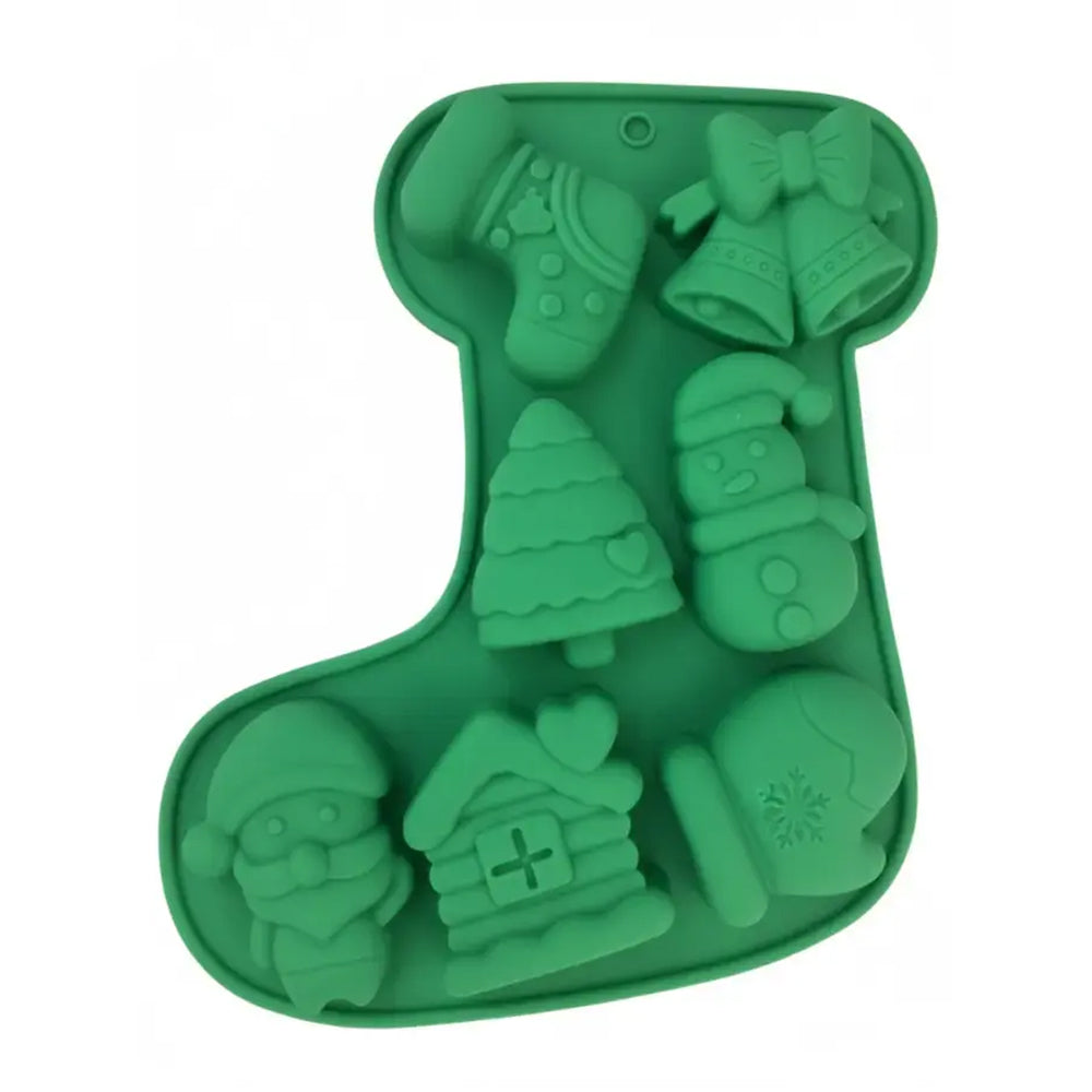 Green silicone mold with Christmas-themed shapes on a white background