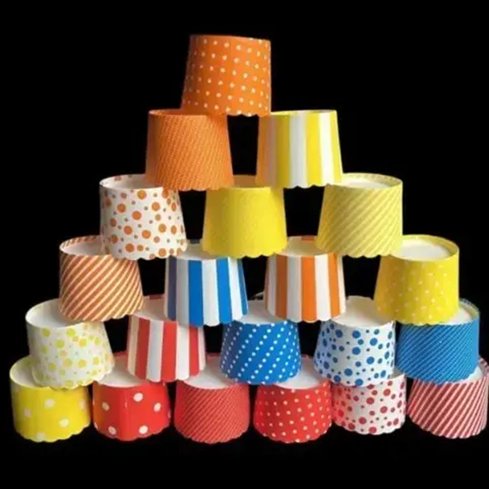 Stack of colorful paper cups with various patterns on a black background