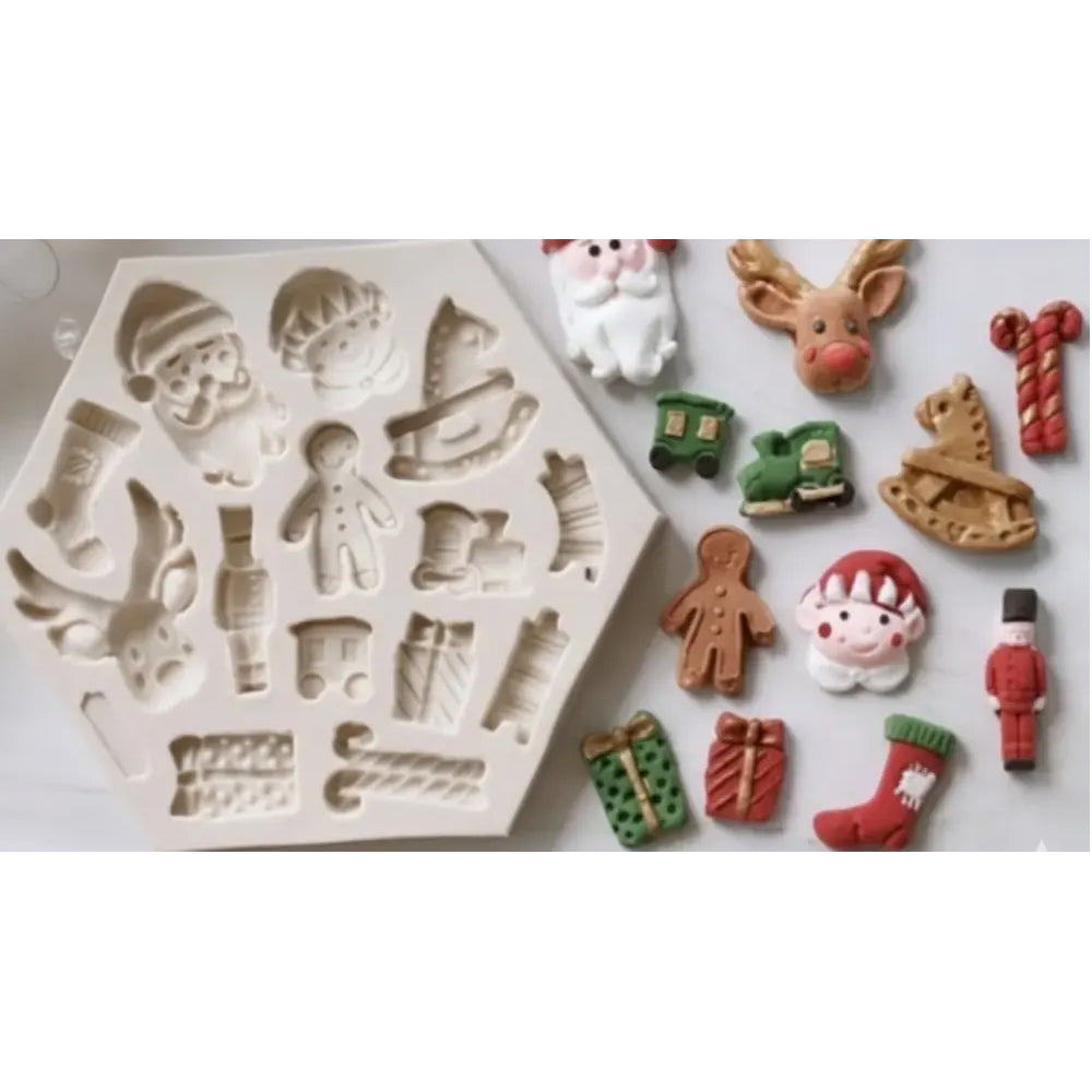Silicone mold with Christmas-themed shapes and corresponding cookies on a white background