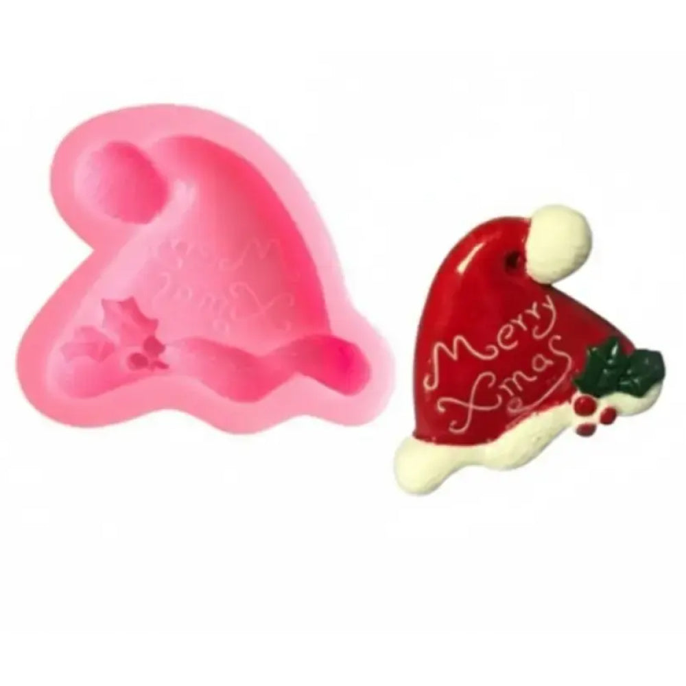 Pink heart-shaped silicone mold and a red Santa hat with 'Merry Christmas' text on a white background