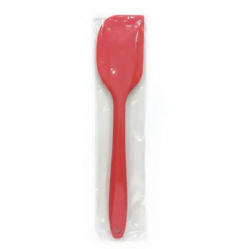 Red spatula in a clear plastic packaging on a white background